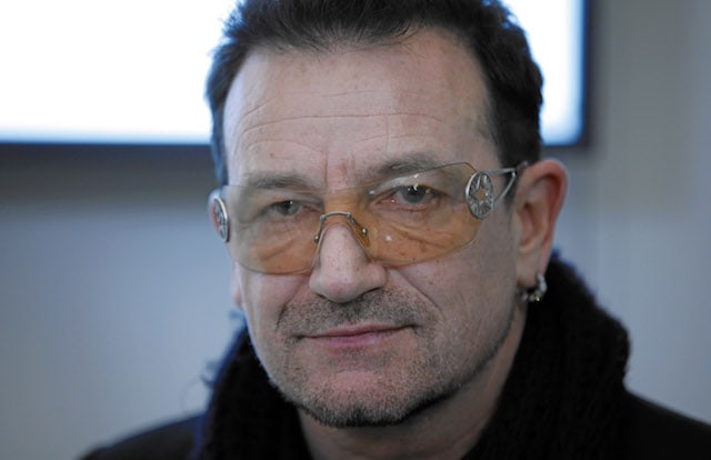 Bono, an artist that has made some insanely wise investments, is seen here wearing his famous orange sunglasses.